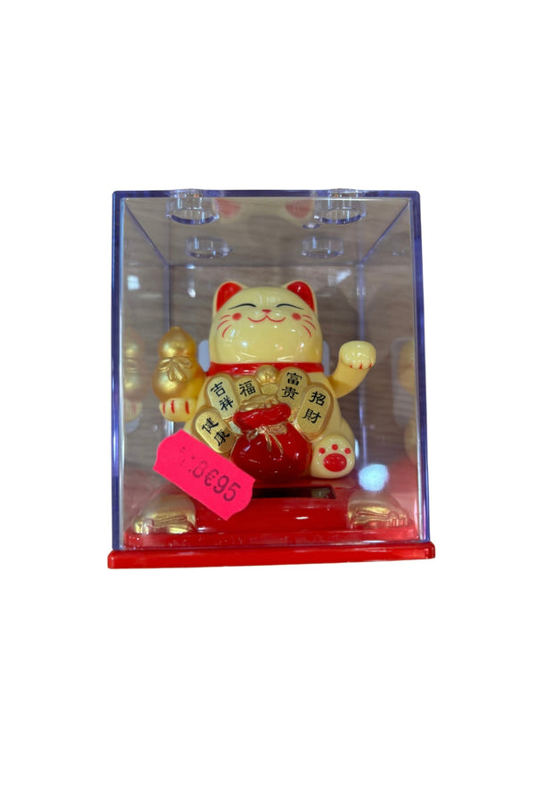 Chat chanceux japonais maneki neko jaune alimenté par piles d'environ 10 cm de hauteur et 10 cm de largeur.